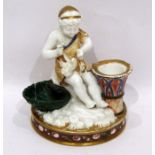 Mid 19th century English porcelain candlestick-inkstand modelled as a scantily draped figure with