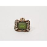 Gold-coloured metal, diamond and green stone dress ring, the rectangular green stone worn,