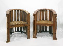 Pair of Eastern hardwood framed tub type chairs with cane seats (2)