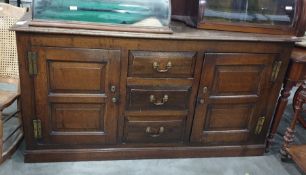 19th century oak dresser base, the rectangular top with moulded edge above three central drawers