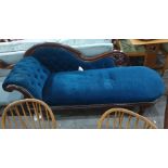 Mahogany Victorian chaise longue with blue ground upholstery, turned supports to brown china castors