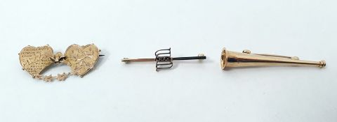 9ct gold trumpet brooch, gold-coloured metal Mizpah brooch and another gold bar brooch (3)