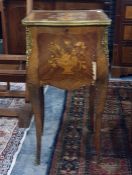Continental, probably French, cabinet with parquetry inlaid top featuring flowers in a vase, moulded