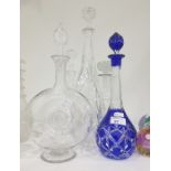 Five various decanters, 20th century, to include: a flashed blue glass example, a bull's eye