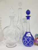 Five various decanters, 20th century, to include: a flashed blue glass example, a bull's eye