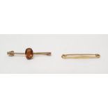 18ct gold plain bar brooch, 1.9g approx and another gold tie bar set with orange stone (2)