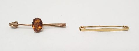 18ct gold plain bar brooch, 1.9g approx and another gold tie bar set with orange stone (2)