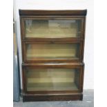 Three part sectional book case in the manner of Globe Wernicke 83.5 x 123 cms.