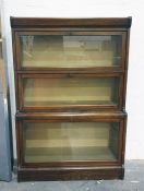 Three part sectional book case in the manner of Globe Wernicke 83.5 x 123 cms.