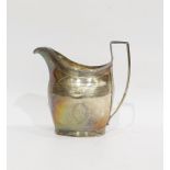 George III silver cream jug, helmet-shaped and engraved with stiff leaves, having reeded angular
