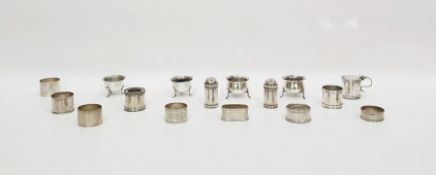 Collection of late 19th/early 20th century silver napkin rings and salt, pepper and mustard pots,