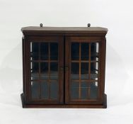 Wall hanging mahogany display cabinet, glazed doors enclosing shelves 50 x 43 cms