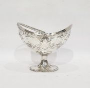 Victorian silver boat-shaped sucriere with beaded swing handle and floral repousse decoration, on