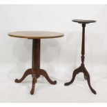 Mahogany plant stand and an oval walnut centre table on faceted telescopic column support, to four