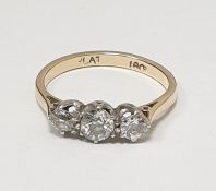 18ct gold three-stone diamond ring, each stone claw set, 0.7ct approx total (one diamond with