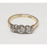 18ct gold three-stone diamond ring, each stone claw set, 0.7ct approx total (one diamond with