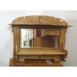 A pine wall hanging mirror back shelving unit