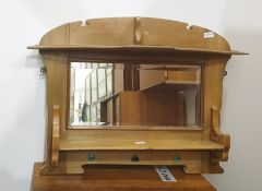 A pine wall hanging mirror back shelving unit