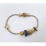 14ct gold Pandora herringbone bracelet with eight 14ct Pandora and other charms, including enamel