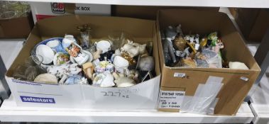 Two boxes of ceramic model animals, small teacups, cats, pigs etc