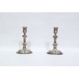Pair of silver Georgian-style candlesticks with turned bulbous stems, raised on circular foot,