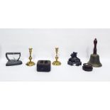 Various items of metalware to include a bell, 29.3cm high, lead weights, doorstop of scroll