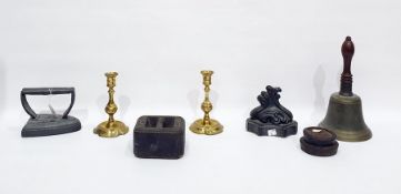 Various items of metalware to include a bell, 29.3cm high, lead weights, doorstop of scroll