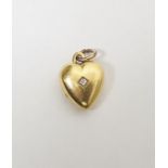 Gold-coloured metal and diamond heart-shaped locket set with old cut stone, 8g approx total