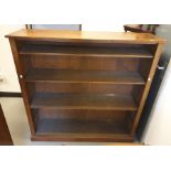 A mahogany open bookcase of four shelves to plinth base 125 x 124.5 cm