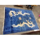 Chinese rug, blue ground with dragon decoration 264 x 356 cm
