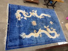 Chinese rug, blue ground with dragon decoration 264 x 356 cm