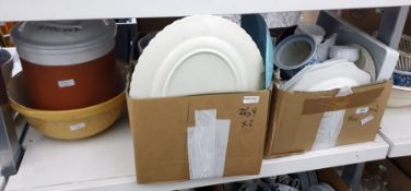 Two boxes of mixed ceramics to include Amstel beer steins, a ceramic bread bin and mixing bowl,