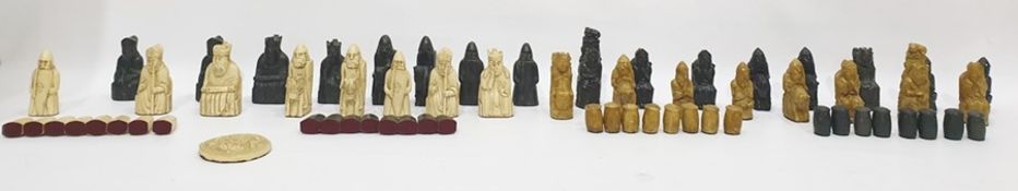 Two Isle of Lewis type resin chess sets in simulated ivory, ebony and stoneware