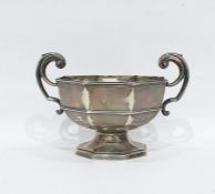 Silver two-handled bowl of octagonal form, with scroll handles, on a raised foot, Sheffield 1923,