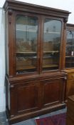 19th century mahogany bookcase cabinet, cavetto and cornice above glazed doors enclosing shelves