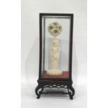 Chinese carved ivory part puzzle ball on stand, 19th century, the ball exterior carved as