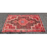 North West Persian Bakhtiar type rug with red ground central medallion on a black ground field