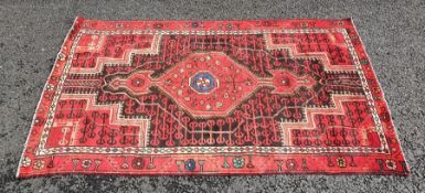 North West Persian Bakhtiar type rug with red ground central medallion on a black ground field