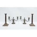 Two pairs of silver plated candlesticks, the first pair with three lights issuing from two