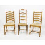 Four oak ladderback dining chairs with rushed seating and two further ladderback dining chairs (6)