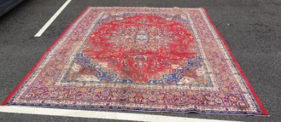 Mahal carpet with stepped central medallion on a red ground foliate field, foliate decorated