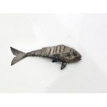 White metal model of an articulated fish, with green eyes, 17cm long, 1oz approx