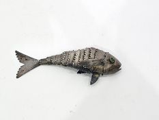 White metal model of an articulated fish, with green eyes, 17cm long, 1oz approx