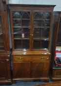 George III style mahogany secretaire bookcase, the upper section ogee choirs enclosed by pair of