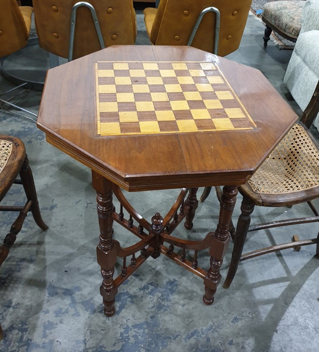 Early 20th century walnut and chessboard inlaid topped centre table raised upon turned and block