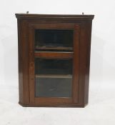 Oak wall-hanging corner cabinet, the single glazed door enclosing three shelves