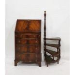A 20th century mahogany serpentine fronted bureau with four drawers, together with pair set of