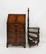 A 20th century mahogany serpentine fronted bureau with four drawers, together with pair set of