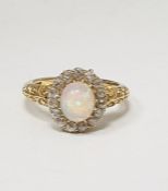 Antique 18ct gold, opal and diamond ring, the central oval cabochon opal surrounded by band of old
