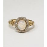 Antique 18ct gold, opal and diamond ring, the central oval cabochon opal surrounded by band of old